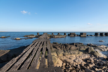 Naklejka premium pier on the coast of Uruguay on a calm day