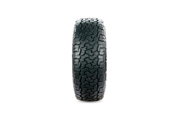 Front view of an all terrain tire designed for use in all road conditions isolated on white background.