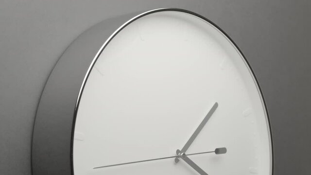 Clock Face on Dark Grey Office Wall in Timelapse