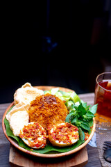 Nasi Ulam, Spicy Boiled Eggs, Indonesian traditional food decorated with  a glass of Tea