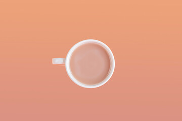 Obraz na płótnie Canvas White cup with black coffee with milk on orange background. Minimalism, Copy space for text. Autumn flat lay