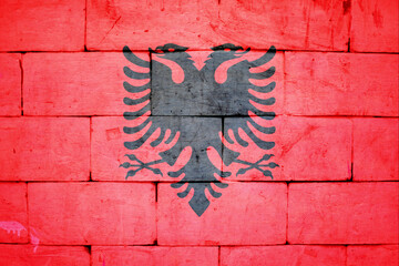 National flag of Albania brick texture, 3d-render and painted wall. Flag background and independence concept.