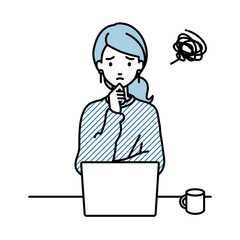 デスクで座ってPCを開いて困っているリモートワークの女性