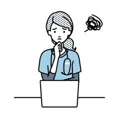 デスクで座ってPCを開いて困っている看護師の女性