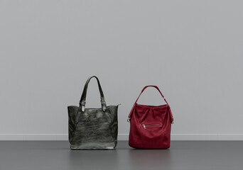 Woman's bag on the floor, cloth and accessories in a grey interior room with copy space, 3d Rendering