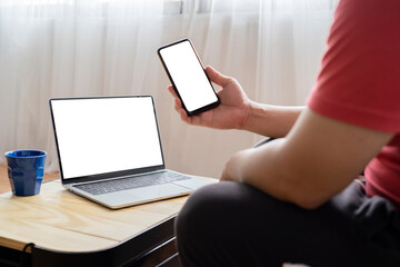 Fototapeta premium mockup image computer,cell phone blank screen for hand typing text