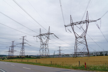 Distribution electric substation with power lines and transformers. High voltage power transformer...
