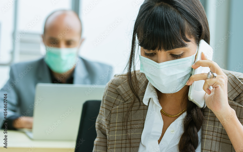 Wall mural smart caucasian businesswoman wearing face mask protect virus, new normal, social distancing, talkin