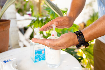 A man is using alcohol antiseptic gel, prevent infection, outbreak of Covid-19.