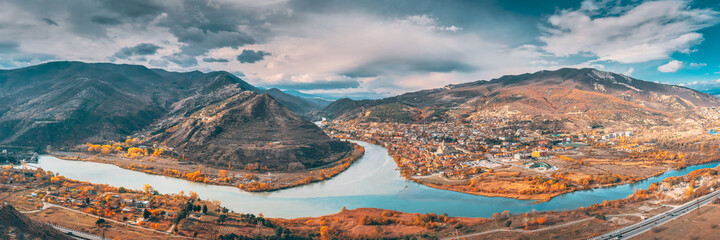 Mtskheta, Georgia. Top View Of Ancient Town Located At Valley Of Confluence Of Rivers Mtkvari Kura And Aragvi In Picturesque Highlands. Autumn Season © Great Brut Here