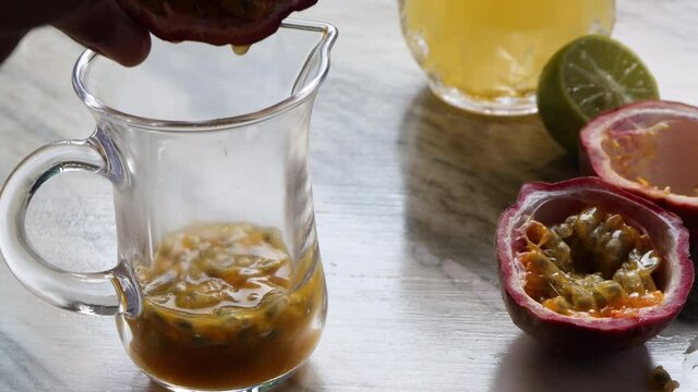 Closeup of Passion fruit with tea spoon for making fresh drink passion fruit with soda.