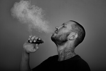 portrait of a young man with a cigarette in profile