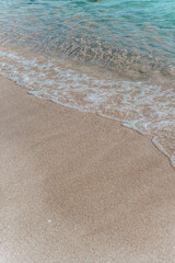 Fototapeta na wymiar background of blue sea water on white sand 