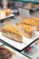 cheesecake on display, a showcase with cakes чизкейк на витрине, витрина с пирожными