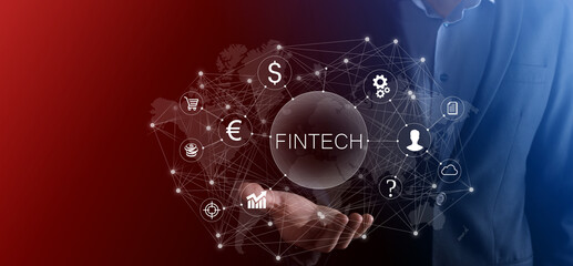 Businessman hold Fintech -financial technology concept.Business investment banking payment. Cryptocurrency investment and digital money. Business concept on virtual screen.