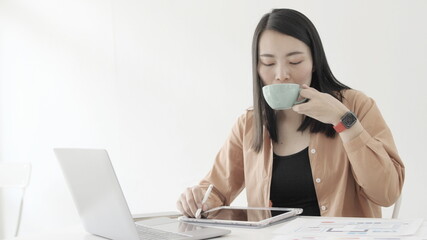 woman hand with a coffee cup  On the desk  Morning lifestyle concept