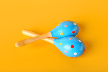 Mexican maracas on color background
