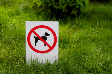Sign prohibiting walking dogs.