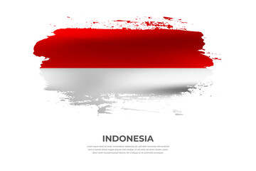 Artistic folded brush flag of Indonesia. Paint smears brush stroke flag on isolated white background