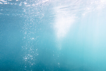 Underwater View of Bubbles In Deep Blue Sea. Close Up Water. Background