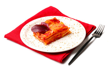 Plate with piece of tasty tomato lasagna on white background