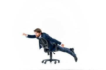 Cheerful man rides in a chair office manager studio