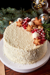 Festive cake with coconut and peaches decorated for Christmas.
