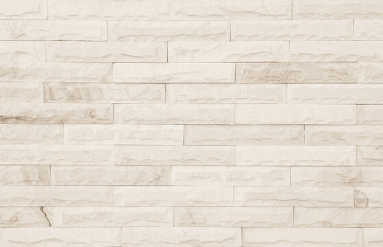 Old brick wall for background and design. Dark sandstone wall texture and background with high resolution, pattern of stone brick wall.