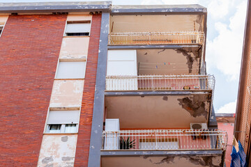 Balconies with cracked concrete and rusty irons requiring renovation.