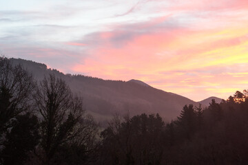 Reddish sunrise between the mountains