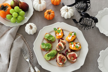 Autumn fruit canapes with figs, persimmon, white grapes and ...