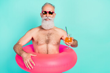 Photo of old man drink juice cocktail toothy smile wear rubber circle sunglass shorts isolated teal...