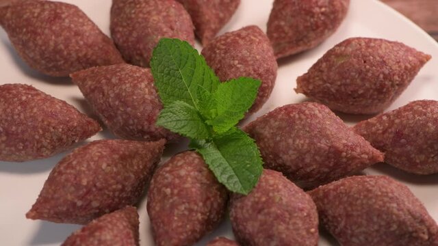 Traditional kebbe on turntable in lebanese restaurant, High quality 4k footage
