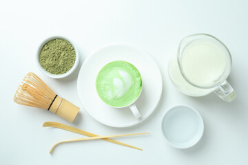 Matcha latte and accessories for making on white background