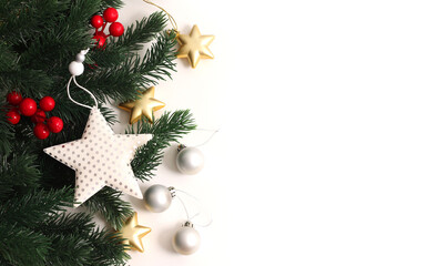 Christmas tree branches and decor on a white isolated background with a place to copy the text. Christmas background.