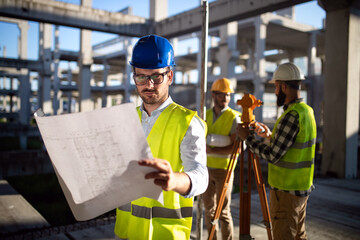 Business building teamwork people concept. Group of engineer with blueprint on construction site