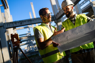 Fototapeta na wymiar Business building teamwork people concept. Group of engineer with blueprint on construction site