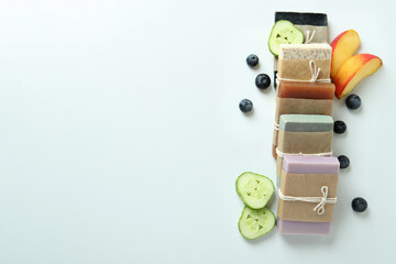 Different natural soap for skin care on white table