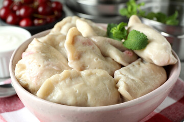 Concept of tasty food with pierogi with cherry, close up