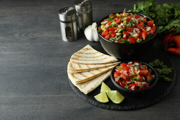 Mexican food concept with Pico de Gallo on dark wooden table