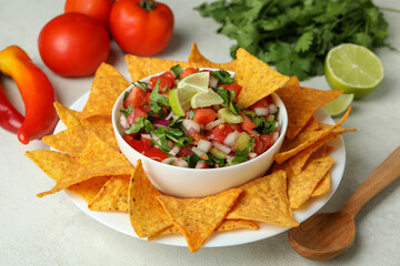 Mexican food concept with Pico de Gallo on white textured table