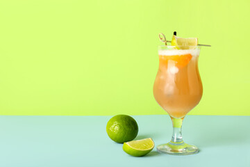 Glass of tasty whiskey sour cocktail on color background