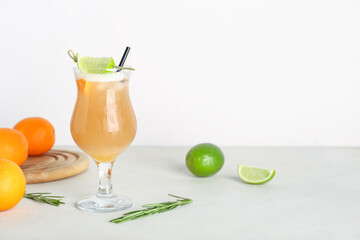 Glass of tasty whiskey sour cocktail on light background