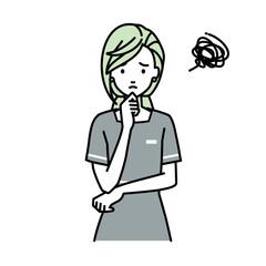 立って手をあごにあてて困っているエステ店員の女性