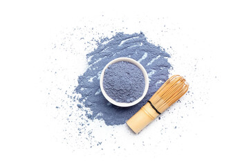 Fototapeta na wymiar Bowl of powdered blue matcha tea and chasen on white background