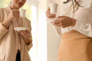 Business people having coffee break in office