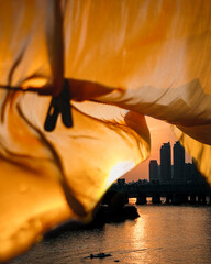 Riverside sunset seen through the curtains