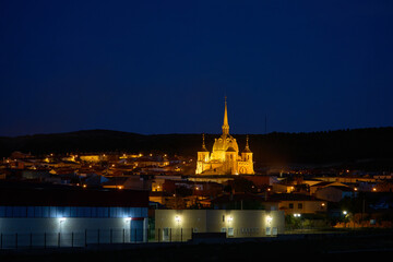 Night view of the town of San Carlos del Valle with the middle ages church of Santo Cristo illuminated with artificial lights,  Ciudad Real province, Castilla la Mancha, Spain