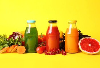 Bottles with healthy juice, fruits and vegetables on color background