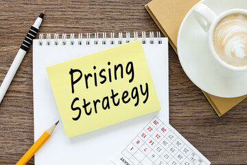 Prising Strategy . Business concept. text on sticker on white paper near white cup of coffee